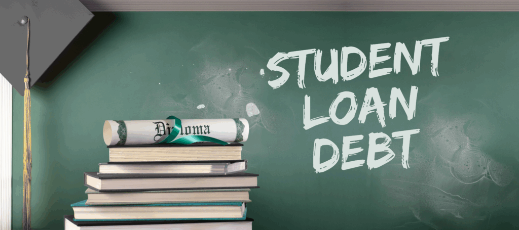 Picture of a green chalkboard with the words "Student Loan Debt" written on it in white chalk. There is a graduation cap hanging from the corner of the chalkboard with its gold tassle hanging down from it. There's also a stack of books pictured in front of the chalkboard with a rolled up diploma sitting on top, wrapped in a loose ribbon.